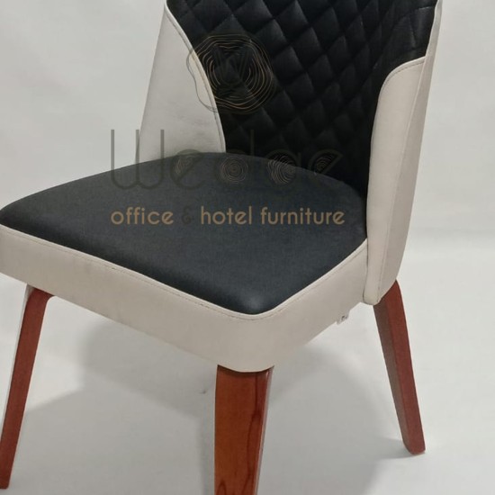 كرسي مودرن ثابت من الجلد وخشب الزان بتصميم أنيق